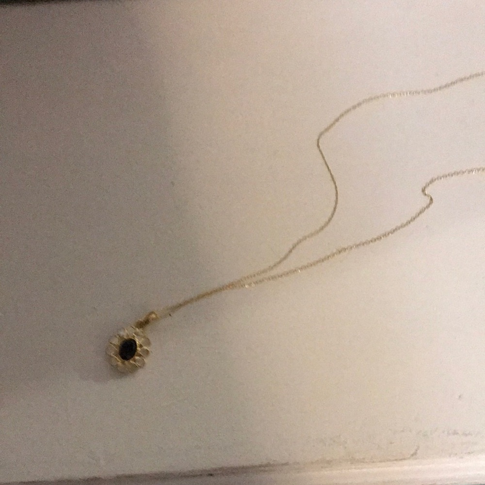 Gold Sunburst Pendant Necklace with Black Center